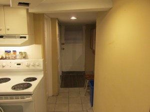 facing south-east to outside door, bathroom and laundry on the left